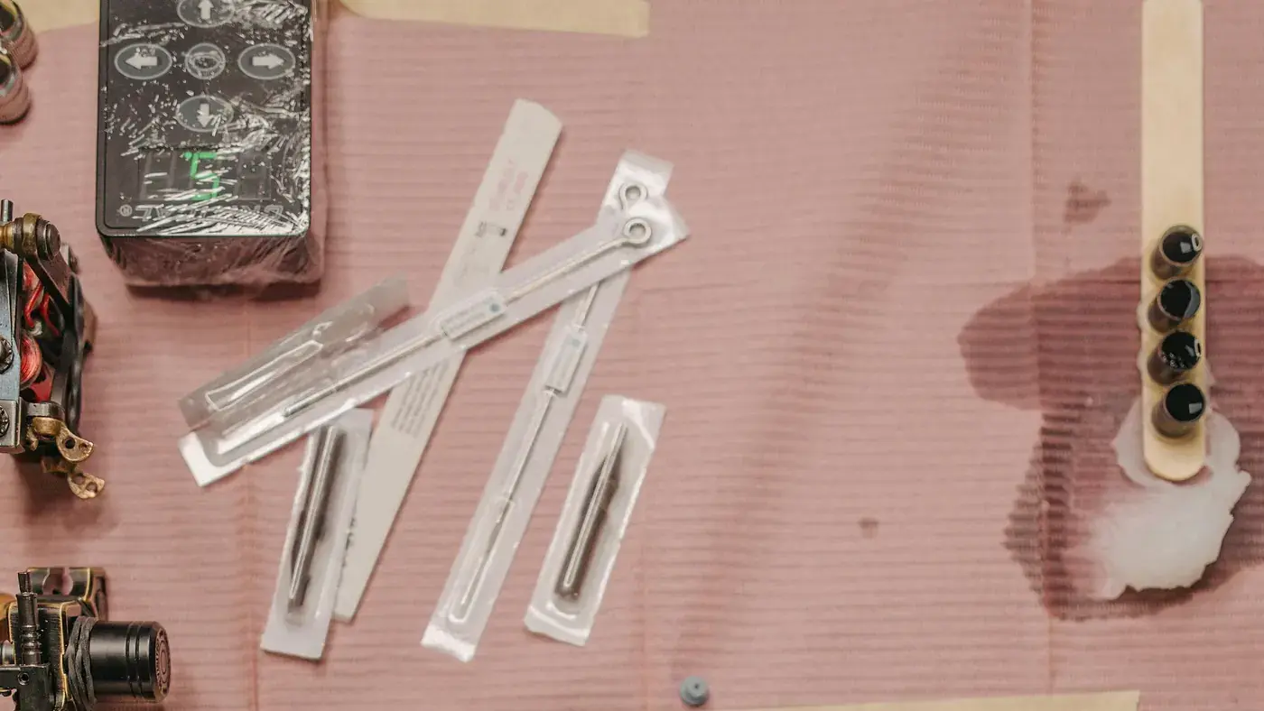 Clean professional tattoo workstation with sterile tattoo equipment.