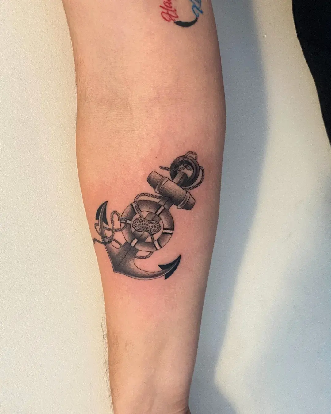Black and grey clock and detailed rose forearm tattoo