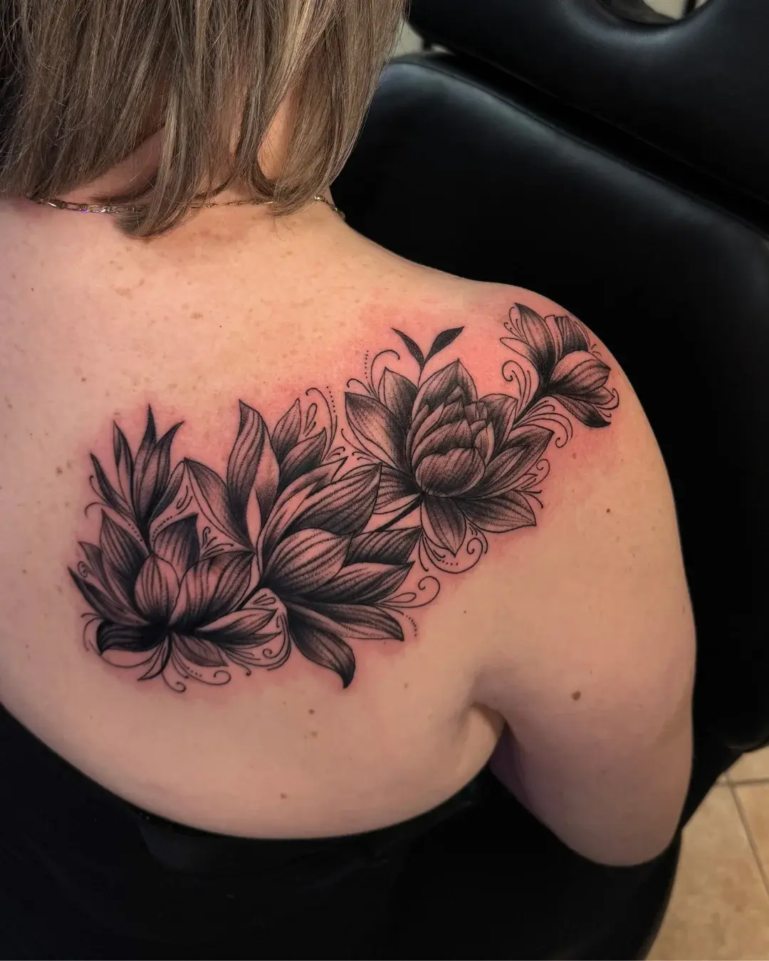 Black and grey Greek statue head tattoo