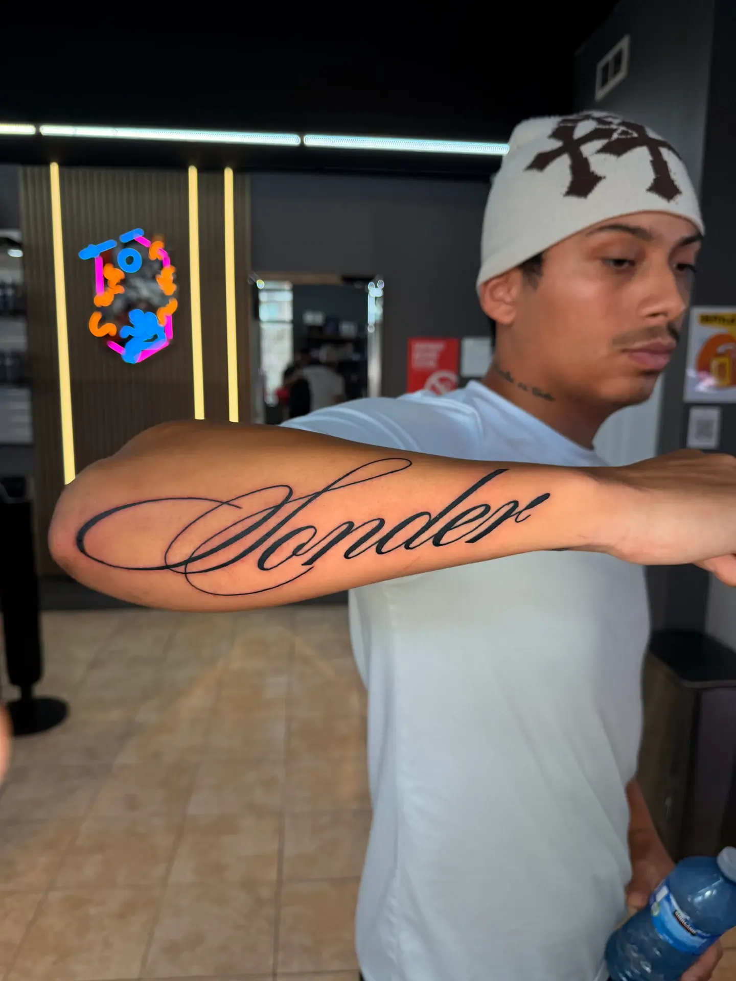Fluid custom calligraphy script tattoo on inner forearm